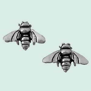 May include: A pair of silver bee stud earrings. The bees are detailed with wings, legs, and antennae.