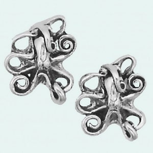 May include: A pair of silver octopus earrings with detailed, curled tentacles.