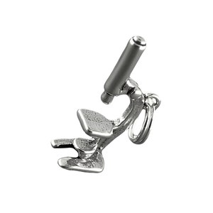 May include: A silver microscope charm with a detailed design. The charm has a loop for attaching to a necklace or bracelet.