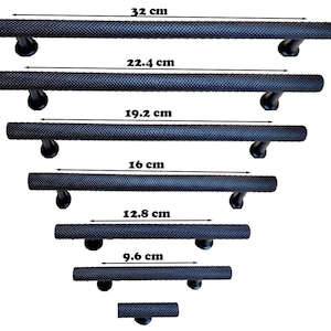 May include: A set of black textured door handles in various sizes, ranging from 3.8 inches to 12.6 inches in length. Each handle has a cylindrical grip and curved mounting brackets, suitable for cabinets or doors.