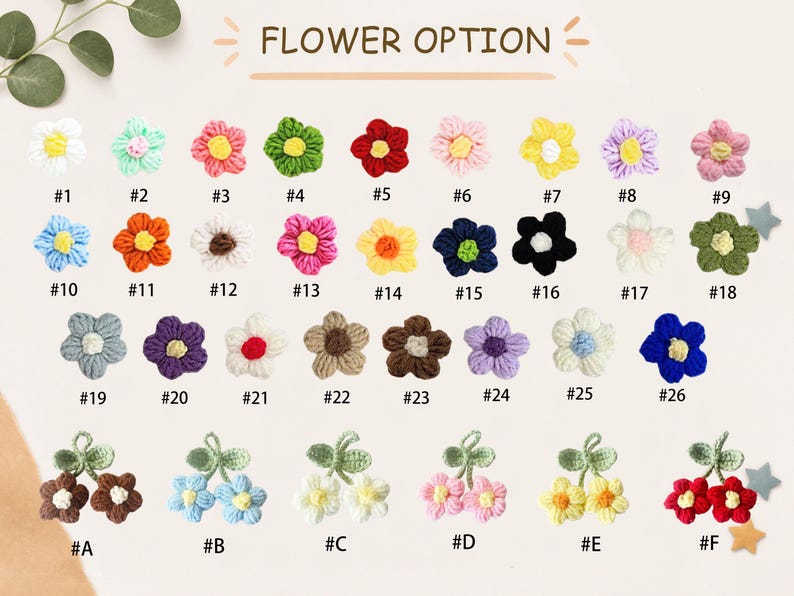 May include: A collection of small crocheted flower appliques labelled with numbers 1 through 18 and letters A through F. The items feature various colour combinations including white, pink, red, green, blue, yellow, purple, and brown petals.