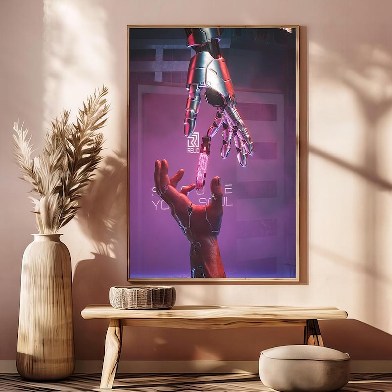 May include: Framed artwork featuring a futuristic scene with a robotic hand reaching towards a human hand. The artwork has a purple and pink color scheme with the text "RELIC" and "SAVE YOUR SOUL". The artwork is displayed on a wooden table.