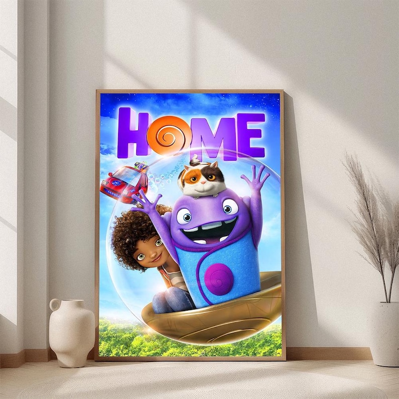 May include: A framed poster featuring characters from the animated movie "Home." The poster has a purple and blue color scheme with the word "HOME" in large, stylized letters. The characters include a purple alien, a girl, and a cat-like creature.