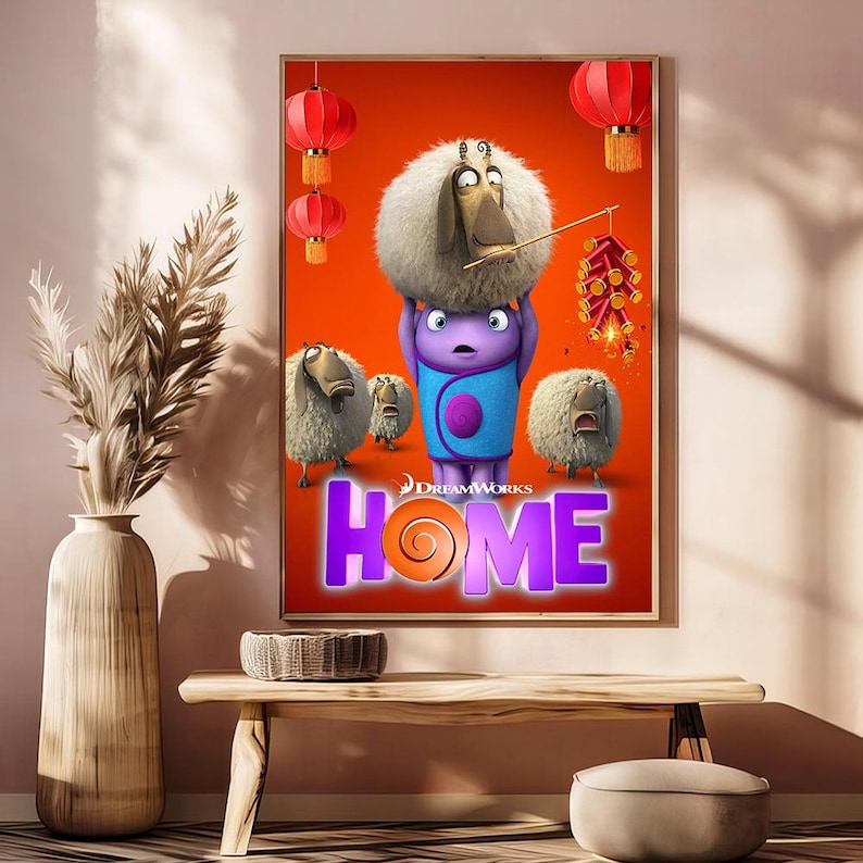 May include: A framed movie poster for the animated film "Home" featuring cartoon characters on an orange background. The title "HOME" is in large purple letters with an orange swirl. Red lanterns and fireworks are also visible.