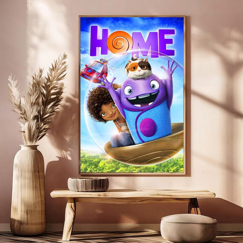May include: A framed movie poster for the animated film "Home." The poster features a purple alien character with a cat on its head, a young girl, and a red car, all set against a blue sky with the word "HOME" in large purple letters.