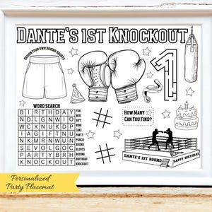 May include: Black and white boxing-themed party placemat with the text "Dante's 1st Knockout." Includes boxing gloves, a boxing ring, a word search, and a maze. The bottom banner reads "Personalized Party Placemat."