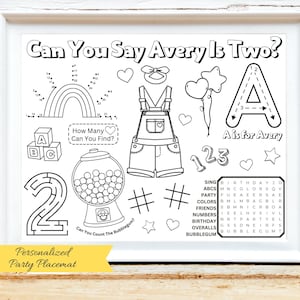 May include: A black and white personalized party placemat with the text "Can You Say Avery Is Two?" and "A is for Avery". The placemat includes a rainbow, overalls, a gumball machine, and a word search puzzle. The bottom of the placemat reads "Personalized Party Placemat".