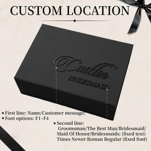 May include: A rectangular black gift box featuring a custom name in a script font on the first line and the word BRIDESMAID in a block font on the second line. The text is black and raised against the black lid of the box.
