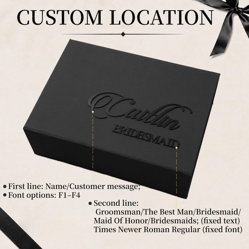 May include: A rectangular black gift box featuring a custom name in a script font on the first line and the word BRIDESMAID in a block font on the second line. The text is black and raised against the black lid of the box.