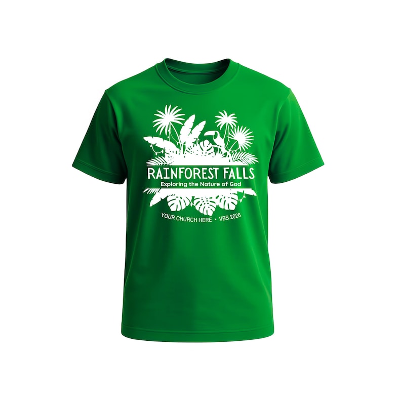 May include: A green t-shirt with a white graphic design featuring the text "Rainforest Falls" and "Exploring the Nature of God." The design includes palm trees and other tropical elements. The text "Your Church Here - VBS 2026" is also included.