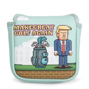 May include: A light blue golf club head cover with a pixelated design. The cover has the text "MAKE GOLF GREAT AGAIN". It features a cartoon image of a man in a suit and a golf bag with clubs. The background includes a white building.