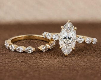 Marquise Cut Diamond Engagement Ring in Yellow Gold with Matching Diamond Wedding Band and Round Side Stones Elegant Bridal Jewelry Design