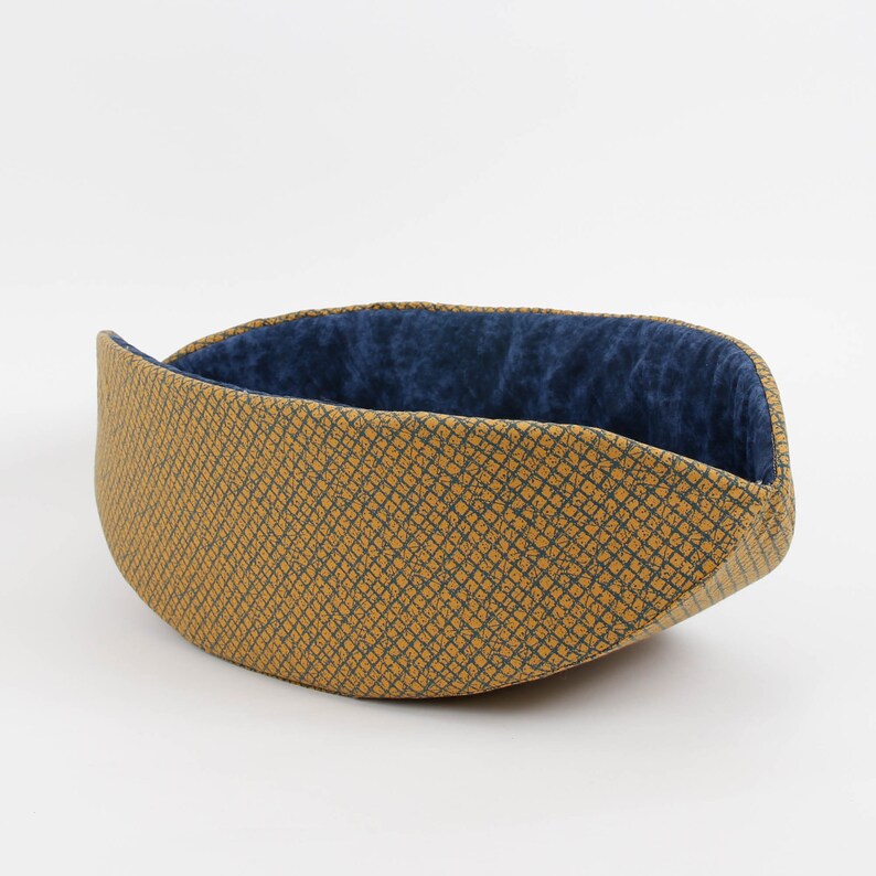 Our innovative Cat Canoe modern cat bed in a contrasting yellow and blue grid print with an unusual textured look. Our flexible beds are made with inner foam panels, are washable, and ready to ship. Fits cats to about 18 pounds, made in the USA.