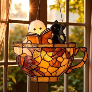 Cute Ghost & Cat Reading in Teacup Suncatcher – Acrylic Window Hanging, Spooky Bookish Halloween Decor, Book Lover Gift Ornament