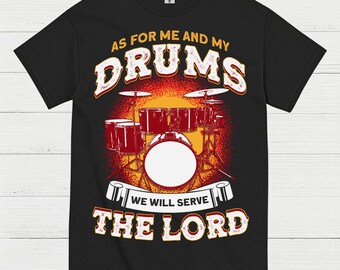 May include: Black t-shirt featuring a drum set graphic with the text "AS FOR ME AND MY DRUMS WE WILL SERVE THE LORD" in a distressed, vintage style. The design includes a red and orange sunset-like background.