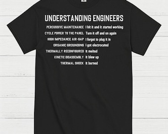 May include: Black t-shirt with white text. The text reads "UNDERSTANDING ENGINEERS" followed by a list of engineering-related phrases and their outcomes, such as "PERCUSSIVE MAINTENANCE I hit it and it started working."