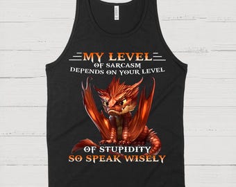 May include: Black tank top with a red dragon graphic. The text reads "MY LEVEL OF SARCASM DEPENDS ON YOUR LEVEL OF STUPIDITY SO SPEAK WISELY". The dragon has orange wings and a stern expression.