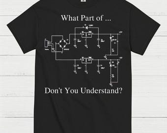 May include: Black t-shirt with a white schematic diagram and the text "What Part of... Don't You Understand?" The diagram includes components like a bridge, resistors, and capacitors, perfect for electronics enthusiasts.