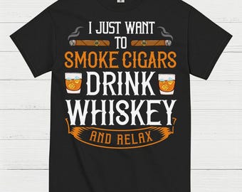 May include: Black t-shirt with the text "I JUST WANT TO SMOKE CIGARS DRINK WHISKEY AND RELAX". The design includes illustrations of cigars and glasses of whiskey. The shirt is made of a soft material.