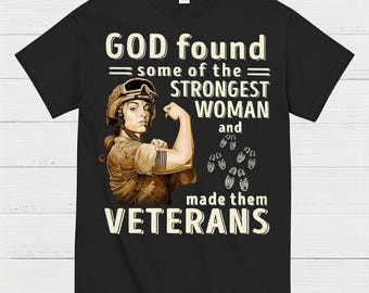 May include: Black t-shirt featuring a graphic of a female soldier flexing her bicep. The text reads "GOD found some of the STRONGEST WOMAN and made them VETERANS". The design includes military boots.