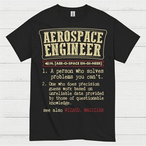 May include: Black t-shirt with the text "AEROSPACE ENGINEER" in a vintage-style font. The shirt includes a definition of the profession, with the words "WIZARD, MAGICIAN" at the bottom.