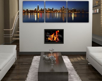 May include: A living room interior with a white couch, a coffee table, and a fireplace. Three framed prints of a cityscape at night hang on the wall above the fireplace.