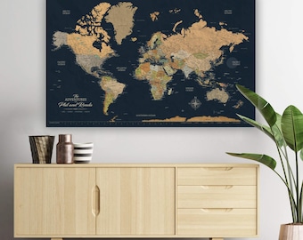 May include: A large world map with a dark blue background and gold-colored continents. The map includes the text "The Adventures Phil and Ronda". The map is displayed above a light wood cabinet with decorative items and a potted plant.