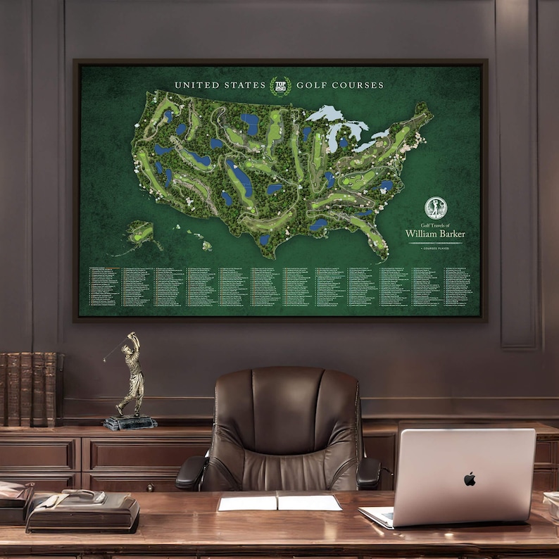a large framed map of the United States with golf courses, displayed in an office setting with a desk, chair, and laptop.