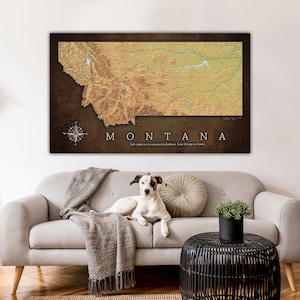 May include: A vintage-style map of Montana with a brown background and a compass in the bottom left corner. The map is printed with the words "MONTANA" and "Life takes us to unexpected places. Love brings us home."