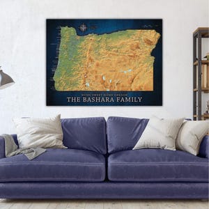 May include: A personalized map of Oregon with a blue background and a topographic map of the state in shades of brown and green. The text "Home Sweet Home Oregon" and "The Bashara Family" is printed below the map.