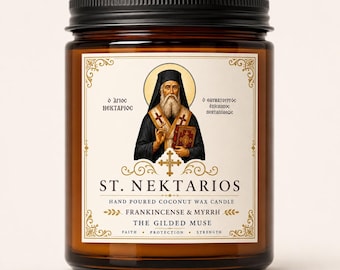 May include: An amber glass jar candle with a black lid, featuring a label with an illustration of St. Nektarios, the text ST. NEKTARIOS, HAND POURED COCONUT WAX CANDLE, FRANKINCENSE & MYRRH, THE GILDED MUSE, FAITH, PROTECTION, STRENGTH.