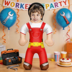 May include: An inflatable worker party decoration featuring a child's face. The decoration is dressed in red overalls with a yellow belt and brown boots. Blue balloons with wrench graphics and a banner that reads "WORKER PARTY" complete the festive scene.