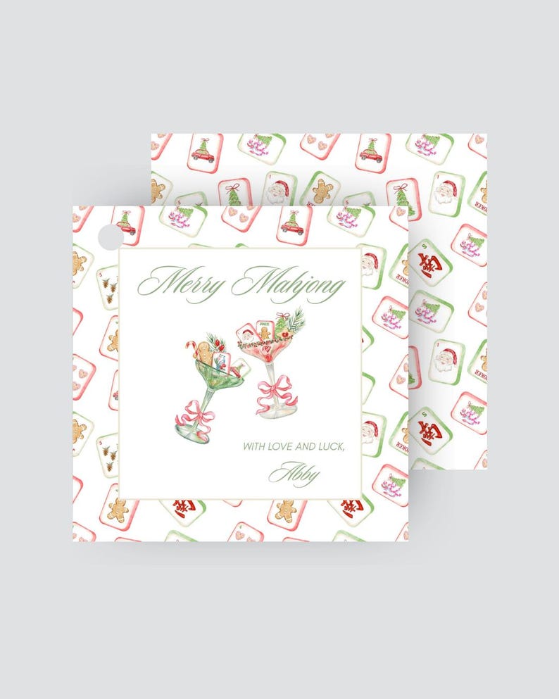 May include: Christmas-themed gift tags with a Mahjong design. The tags feature a watercolour design with cocktails, Mahjong tiles, and the text "Merry Mahjong". The tags are white with a repeating pattern of Christmas-themed Mahjong tiles.