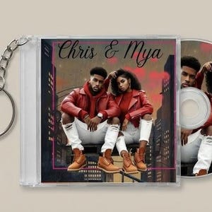 May include: A CD case and disc featuring a couple in red jackets and white jeans, with the text "Chris & Mya." The background shows a city skyline with red accents. A silver keychain is attached to the case.