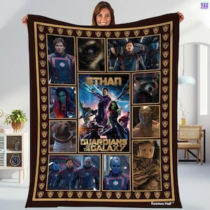 May include: A brown blanket featuring a collage of images from the movie "Guardians of the Galaxy." The blanket includes character portraits, the movie title, and the name "Ethan." The border is a darker brown with a gold pattern.
