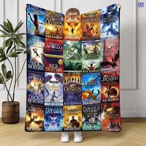 May include: A large, rectangular fleece blanket featuring book covers from the Percy Jackson and Heroes of Olympus series by Rick Riordan. The blanket displays various book titles with colorful illustrations and author's name.