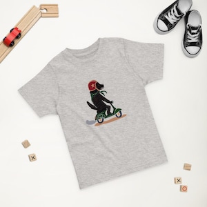 Dog on Scooter Toddler T-Shirt – Fun Animal Tee for Kids – Soft Cotton Shirt in 4 Colors – Cute Gift for Dog Lovers & Adventurous Toddlers