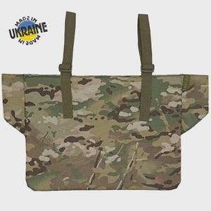 May include: Camouflage pattern tote bag with olive green straps and the text "MADE IN UKRAINE". The bag features a mix of brown, green, and tan colors. The brand name "MELGO" is visible on the side.