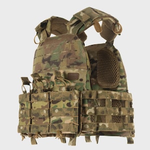 May include: A tactical plate carrier vest featuring a multi-terrain camouflage pattern. The vest includes a front panel with laser-cut MOLLE webbing, three integrated magazine pouches with retention tabs, padded shoulder straps, and side mesh panels.