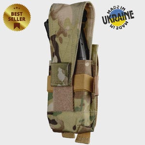 May include: Camouflage tactical pouch with multiple compartments and straps. The pouch has a flap closure and is designed to hold a variety of items. A gold "Best Seller" seal and a "Made in Ukraine" stamp are visible.