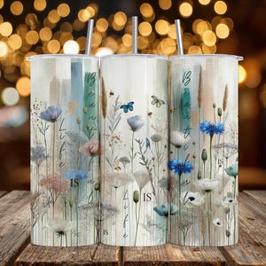 May include: Three stainless steel tumblers with floral designs and the words "Beautiful Life Is" in a vertical script. The tumblers feature a watercolor style with blue, pink, and white flowers, and butterflies.