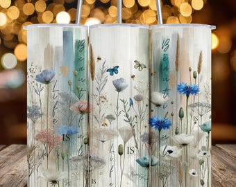 May include: Three stainless steel tumblers with floral designs and the words "Beautiful Life Is" in a vertical script. The tumblers feature a watercolor style with blue, pink, and white flowers, and butterflies.