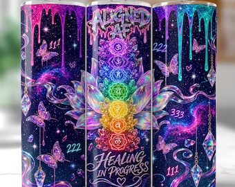 May include: A cylindrical tumbler featuring a dark space-themed background with colorful dripping paint effects, butterflies, and hanging crystals. The design includes a central lotus flower with seven chakra symbols, the text ALIGNED AF and HEALING IN PROGRESS, and the repeating numbers 111, 222, and 333.