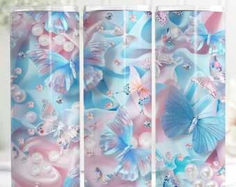 May include: Three tall, cylindrical tumblers with a butterfly design. The design features blue and pink butterflies, pearls, and sparkling accents on a light blue and pink background. The tumblers are likely for beverages.