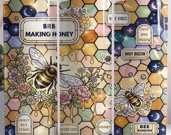 May include: Three colorful tumblers with a bee-themed design. The design includes bees, flowers, honeycombs, and text that reads "BRB MAKING HONEY", "Sweet But Sting", "Bee Kindish", and "Cute and Buzzy". The tumblers are cylindrical.
