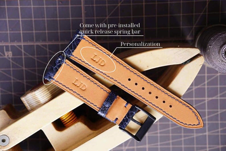 May include: Two leather watch straps with blue accents and stitching, featuring the initials "LJD" embossed on the tan leather. The straps have a blue textured section and a black buckle. The text "Come with pre-installed quick release spring bar" and "Personalization" are visible.