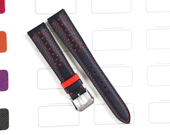 May include: Black watch straps with red stitching and red detailing. The straps feature a perforated pattern and a silver buckle. The watch straps are shown on a white surface with colour swatches.
