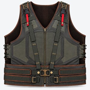 May include: A dark olive green and brown tactical vest featuring a front zip closure, adjustable shoulder straps with black plastic buckles and red accents, side lacing details, and a horizontal waist belt with metallic buckles and brass-toned hardware.