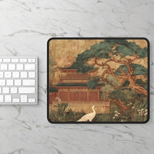 May include: A rectangular mousepad featuring an Asian-inspired landscape. The design includes a traditional building with red and green accents, a large tree, and a white bird. The mousepad has a black border and is set against a marble background.
