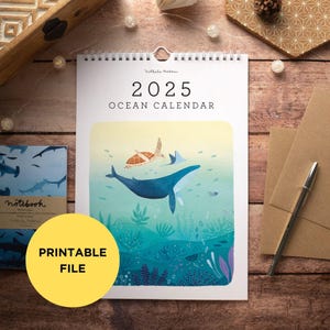May include: A printable 2025 ocean calendar featuring a blue whale swimming with a sea turtle in a colorful underwater scene. The calendar is titled "2025 Ocean Calendar".